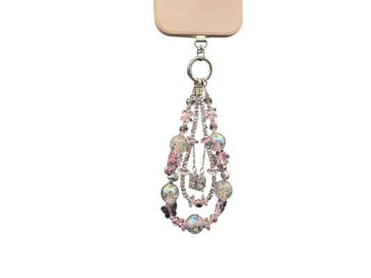 Bracelet Rose Cristal Bloomeliya rose poudré et argent, complet porté sur un téléphone