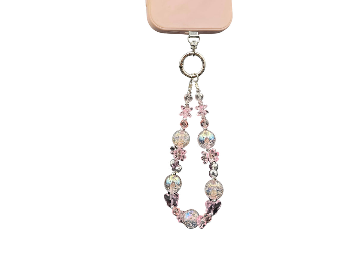 Bracelet Rose Cristal Bloomeliya rose poudré et argent, 3e rangée seule sur un téléphone