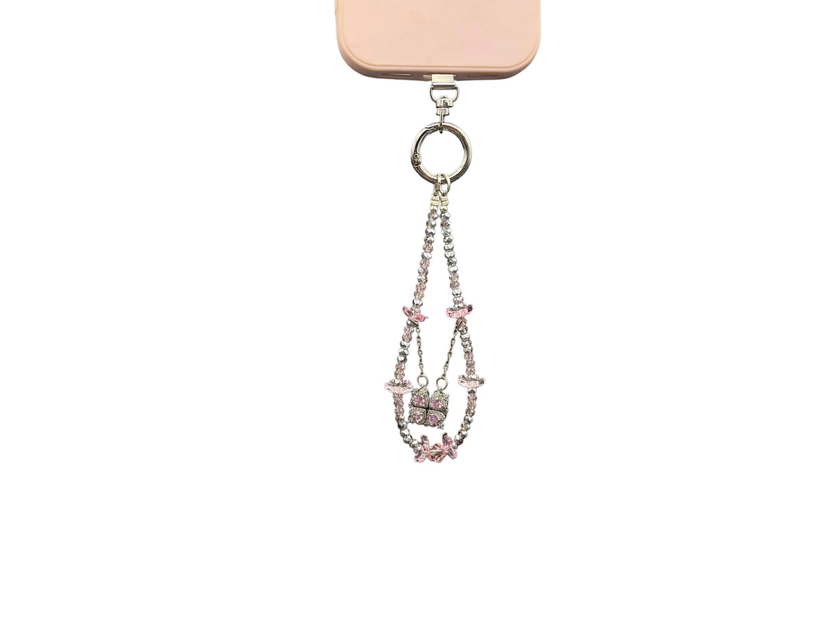 Bracelet Rose Cristal Bloomeliya rose poudré et argent, 1re rangée seule sur un téléphone